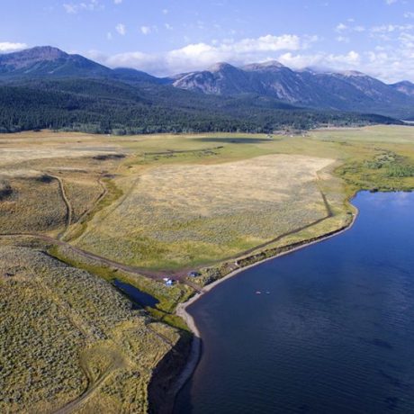 Vast landscape with body of water and mountains