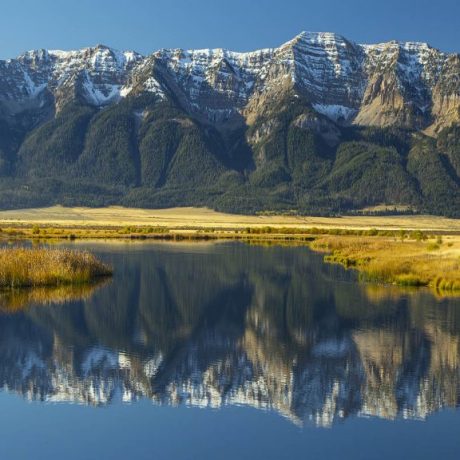 Vast landscape with body of water and mountains