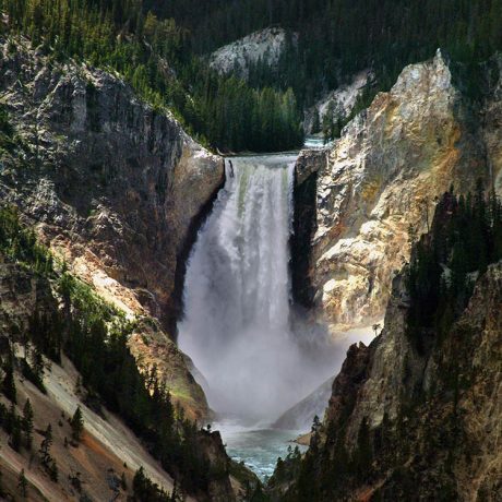 Big waterfall in the middle of the mountain forest